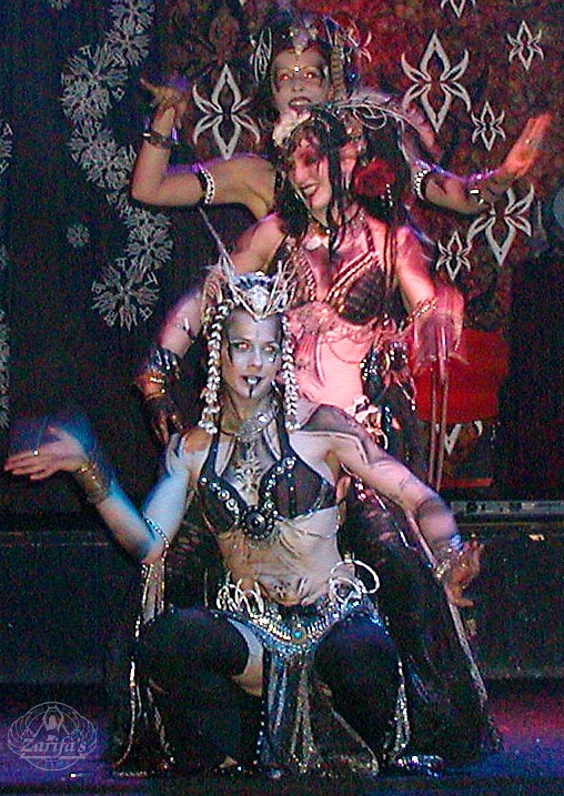 Dancers in costume scurried about here and there, adorned with full body 