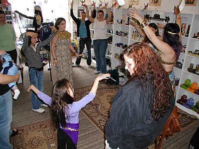 Visitors at Zarifa's First Anniversary Celebration take in a dancing lesson